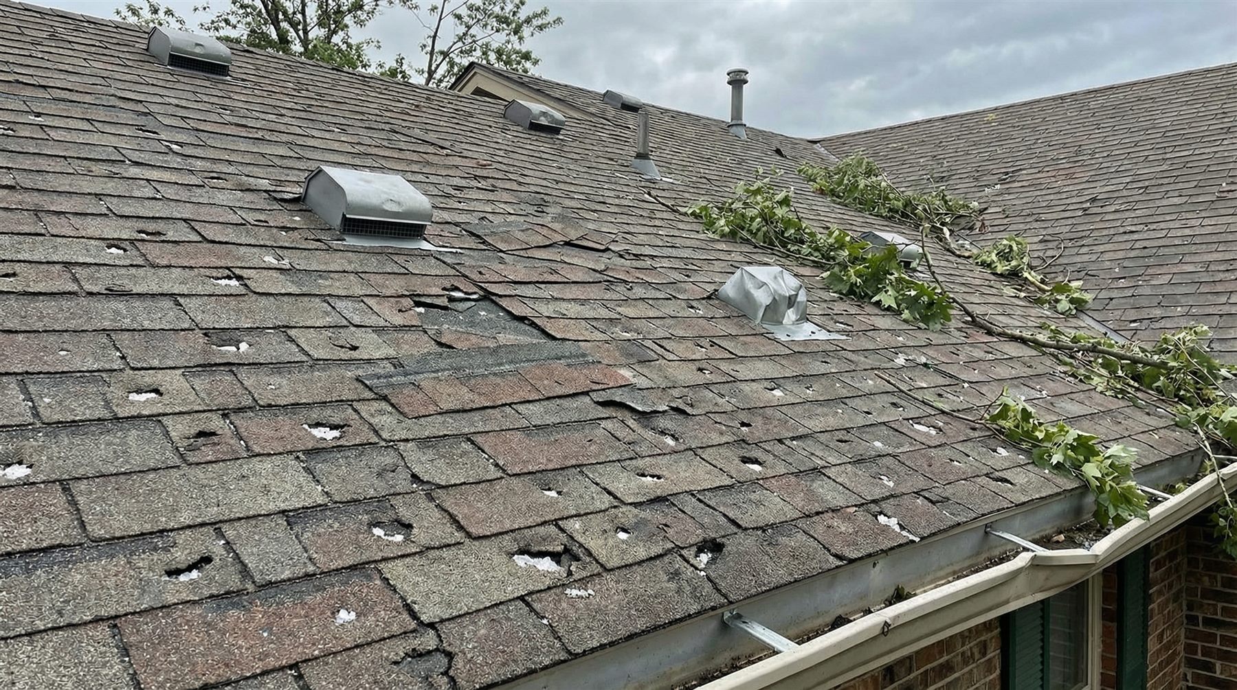 Hail damaged roof before storm damage repair - Cary, NC